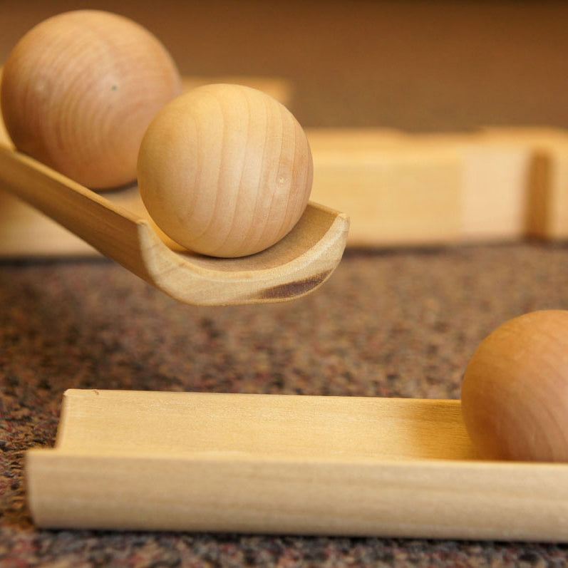 Three sizes of durable wood balls with water-resistant finish for outdoor ramp sets