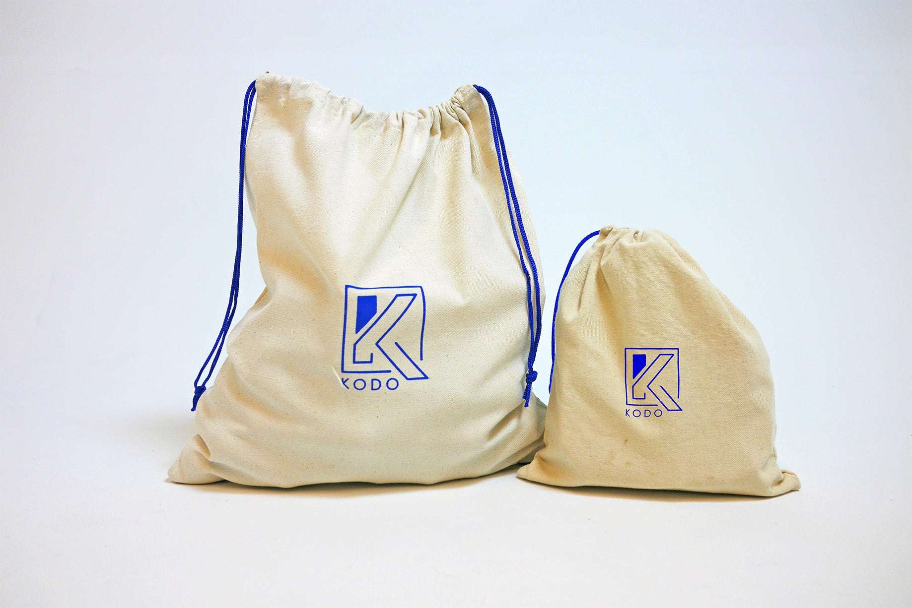 Canvas storage bags in two sizes with drawstring closures for organizing materials