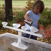 Funnel Stand with six funnels on a classroom sensory table for hands-on play and learning