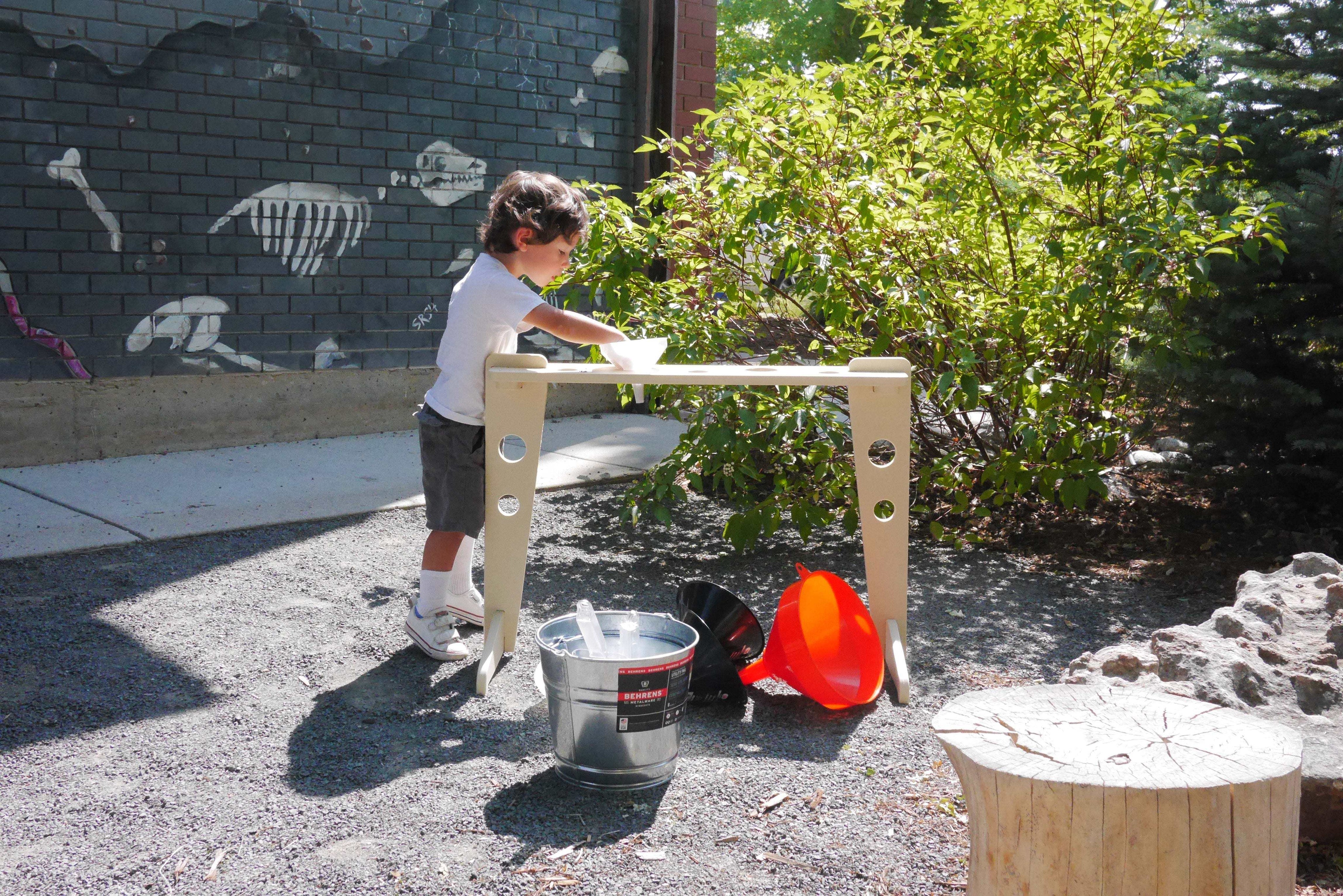 Kodo Outdoors Comprehensive Set with ramps, metal pails, balance, funnel stand, and storage for STEM outdoor learning