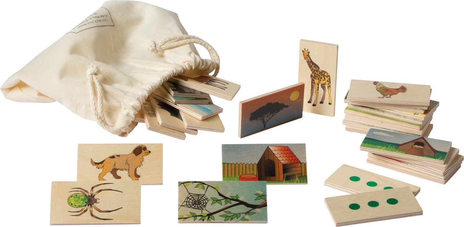 Wooden animal and habitat matching tiles with colorful illustrations and self-correcting dots, stored in a cotton drawstring bag.