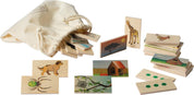 Wooden animal and habitat matching tiles with colorful illustrations and self-correcting dots, stored in a cotton drawstring bag.