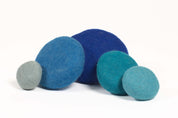 Stacked blue wool pieces for sensory play and motor skill development in classrooms