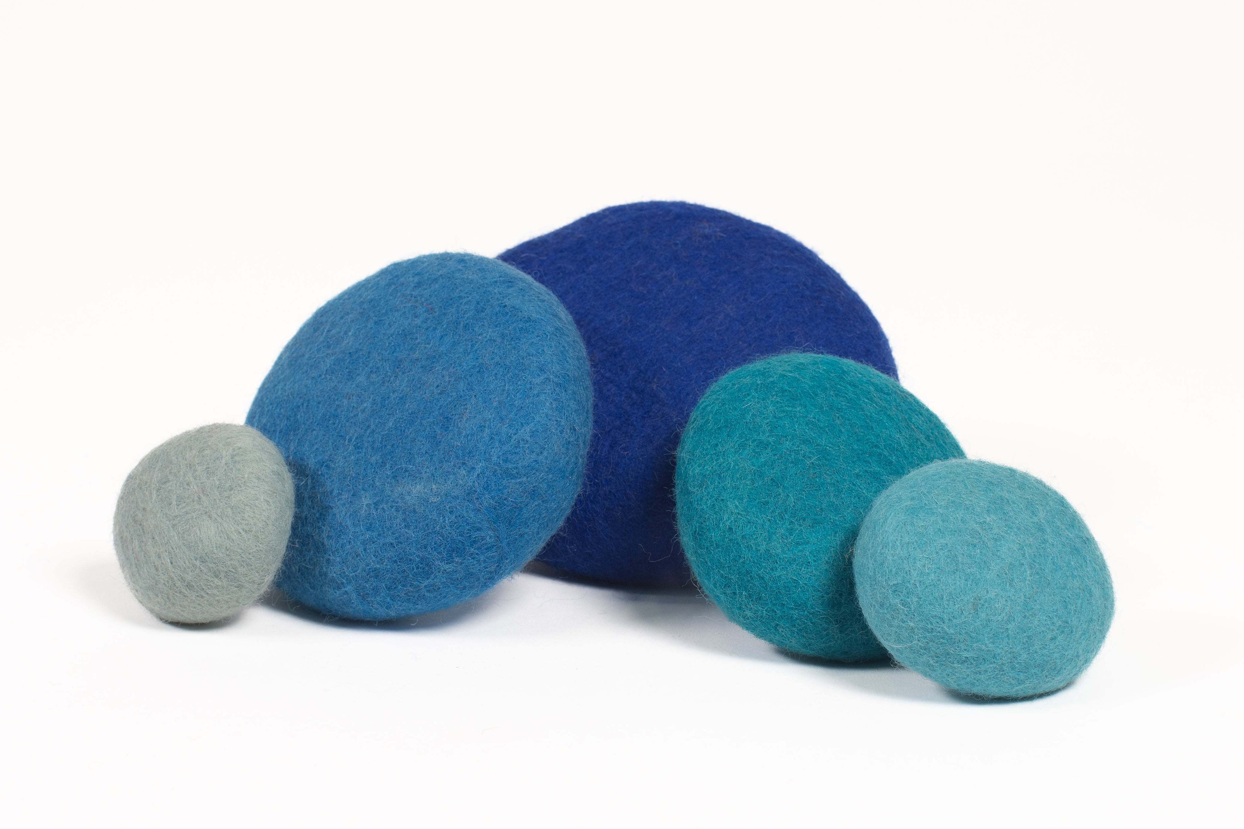 Stacked blue wool pieces for sensory play and motor skill development in classrooms