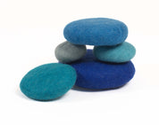 Stacked blue eco-friendly wool pieces for sensory play and learning in classrooms