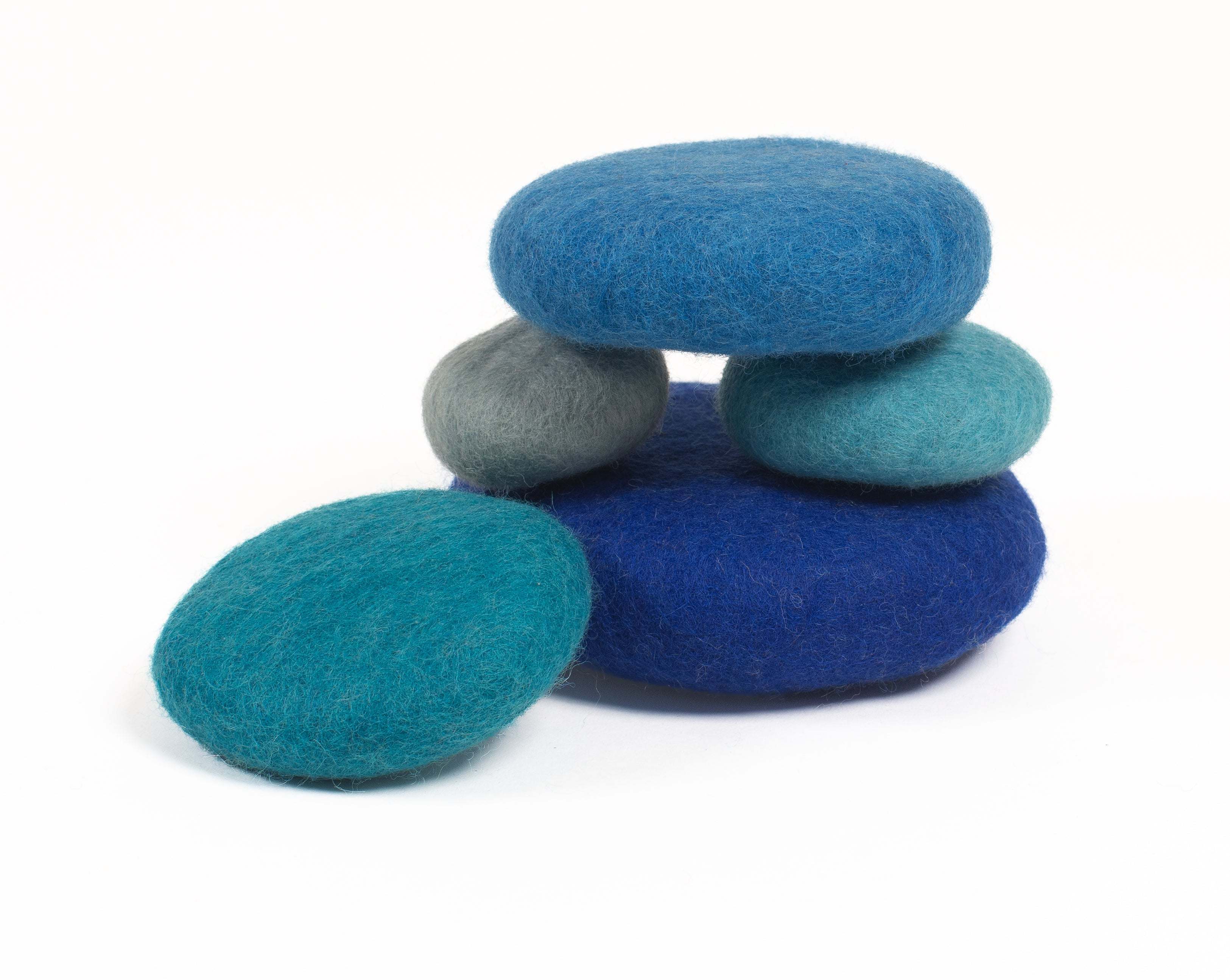 Stacked blue eco-friendly wool pieces for sensory play and learning in classrooms