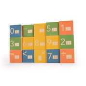 Colorful wooden math blocks featuring embossed numbers, symbols, and corresponding Braille cells.