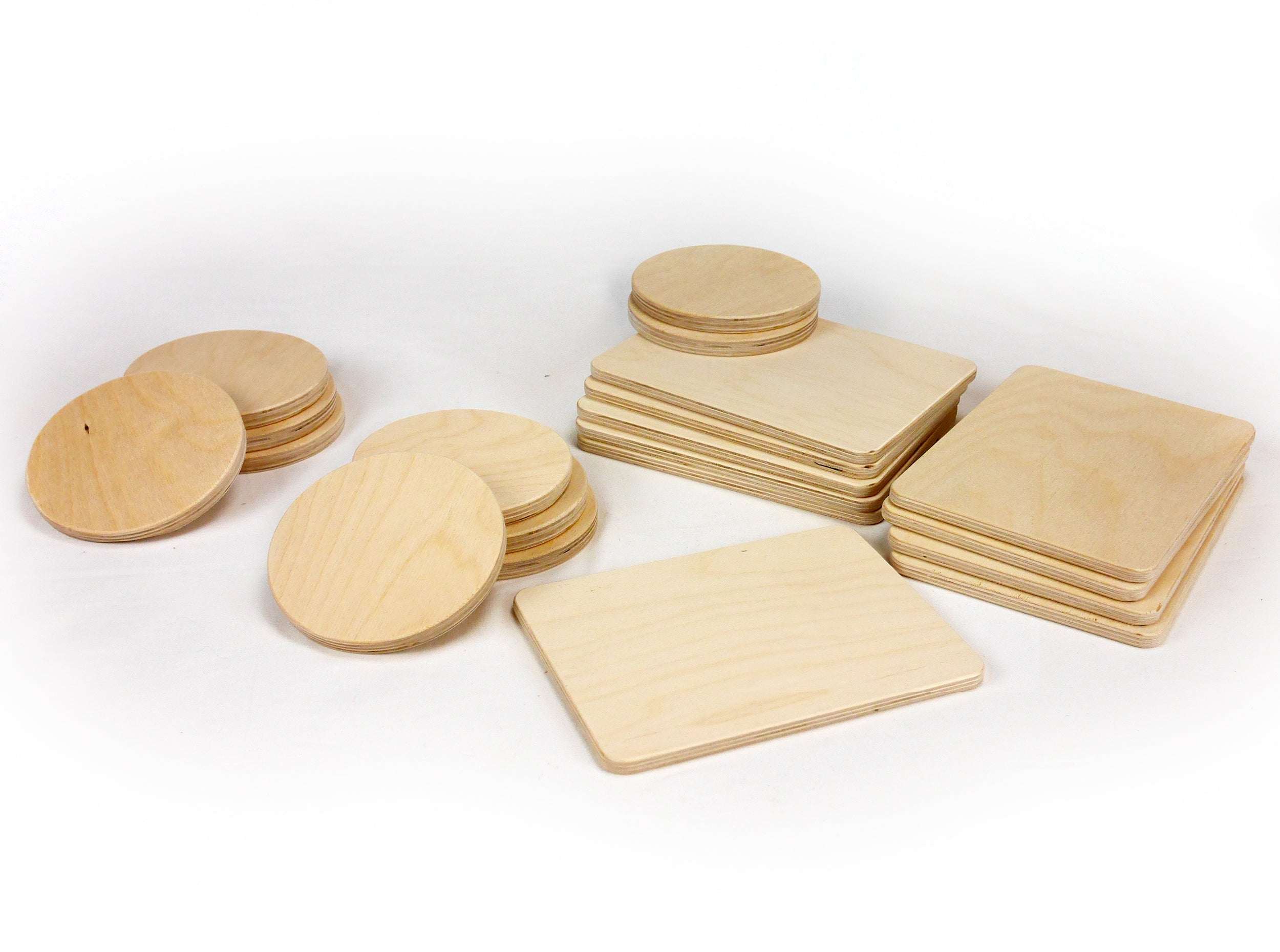Set of natural light wood building boards and circles in rectangular and round shapes for creative play.