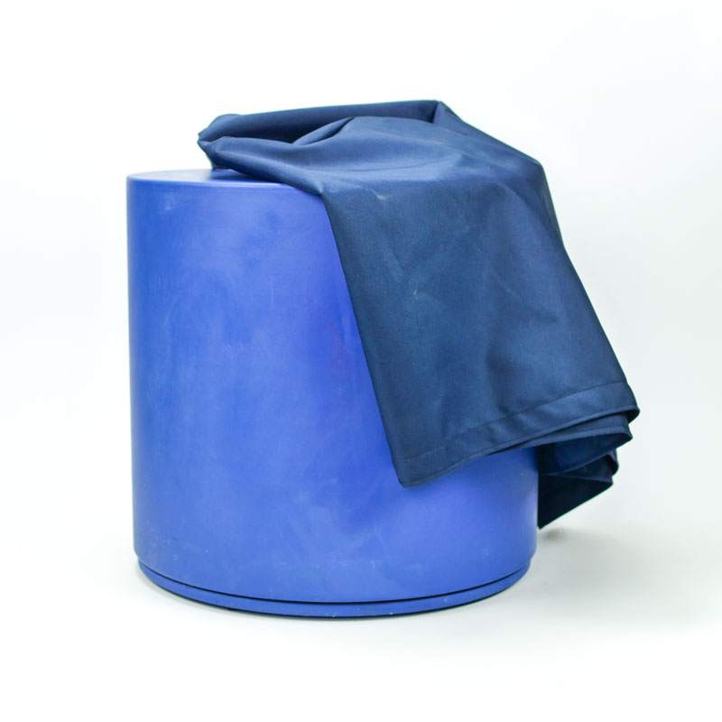 Dark blue nylon cover draped over a cylindrical blue Chalk Spinner against a white background.