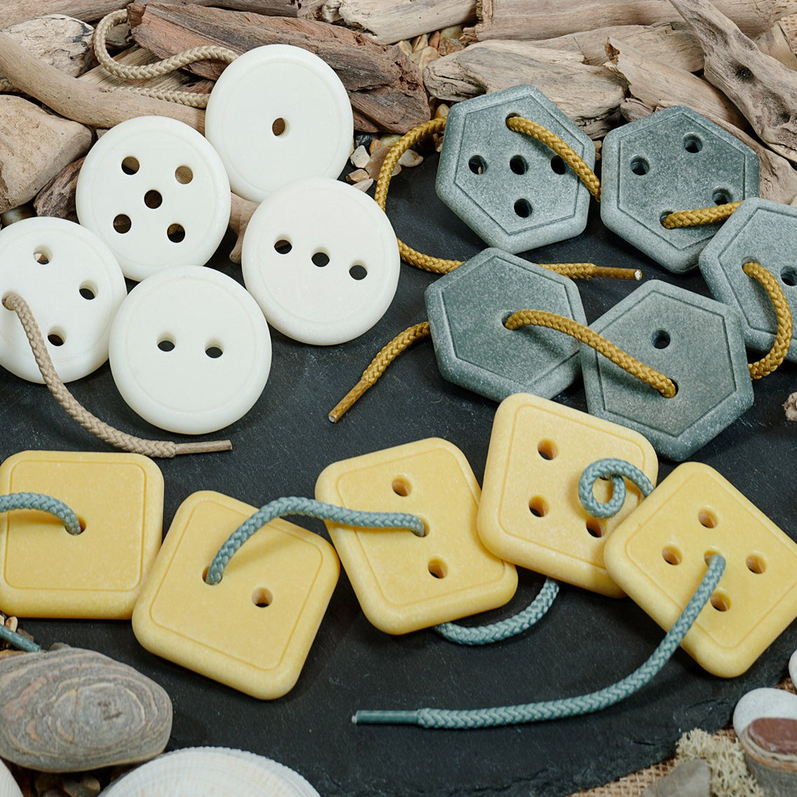 Count & Thread Stones set with colorful button-like stones for sorting and sequencing tasks