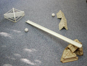 Deflector set with wooden ramp, white balls, and molded fiber supports arranged on a grey carpet for geometry play.