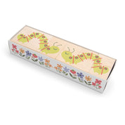 Six wooden blocks in a box featuring a green caterpillar illustration and colorful garden flowers.