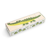 Six wooden basswood blocks in a box featuring an alligator illustration and green frog patterns on the sides.