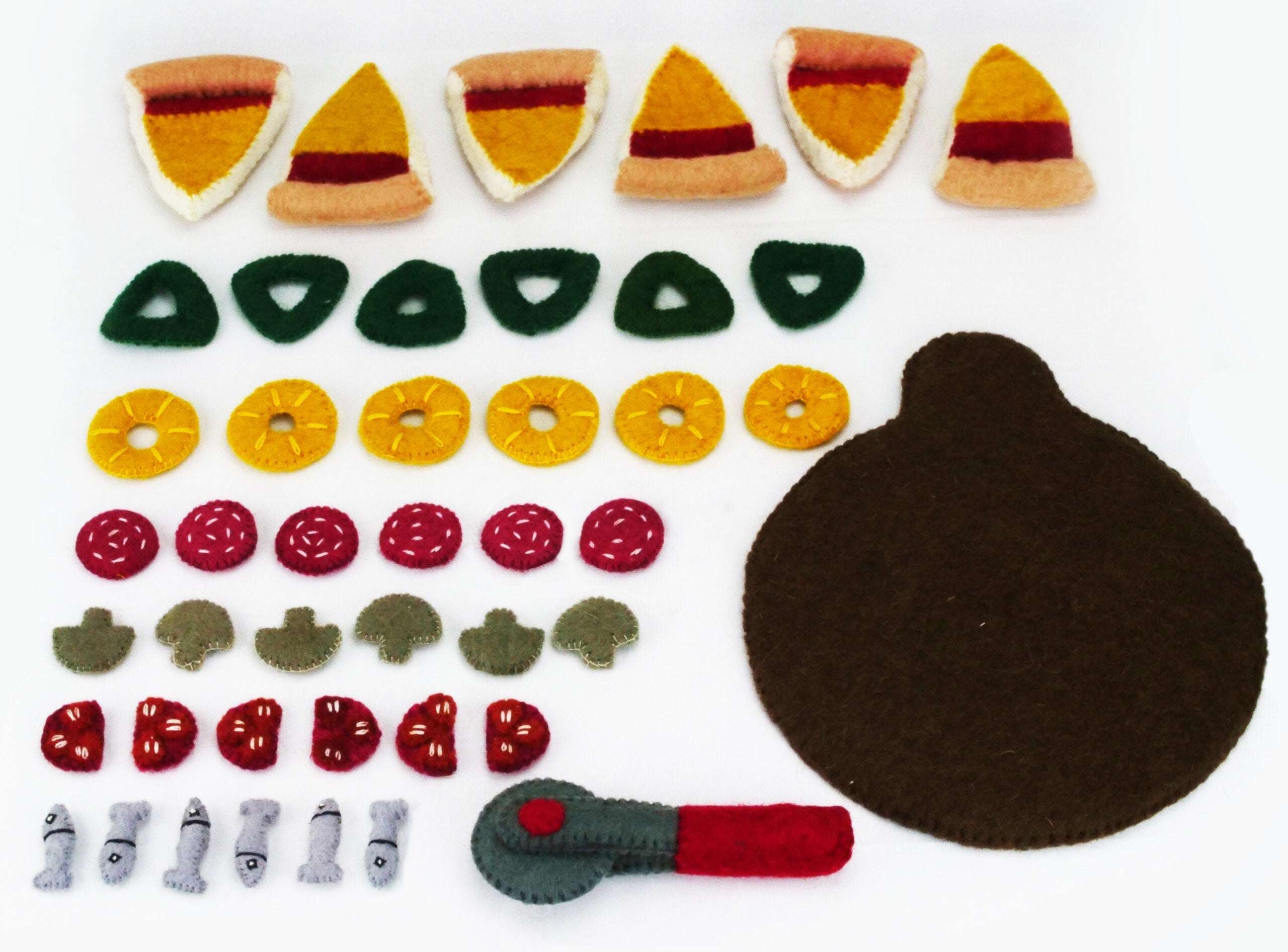 Handcrafted felted wool pizza set with colorful toppings, crust slices, and a toy pizza cutter on a white background.