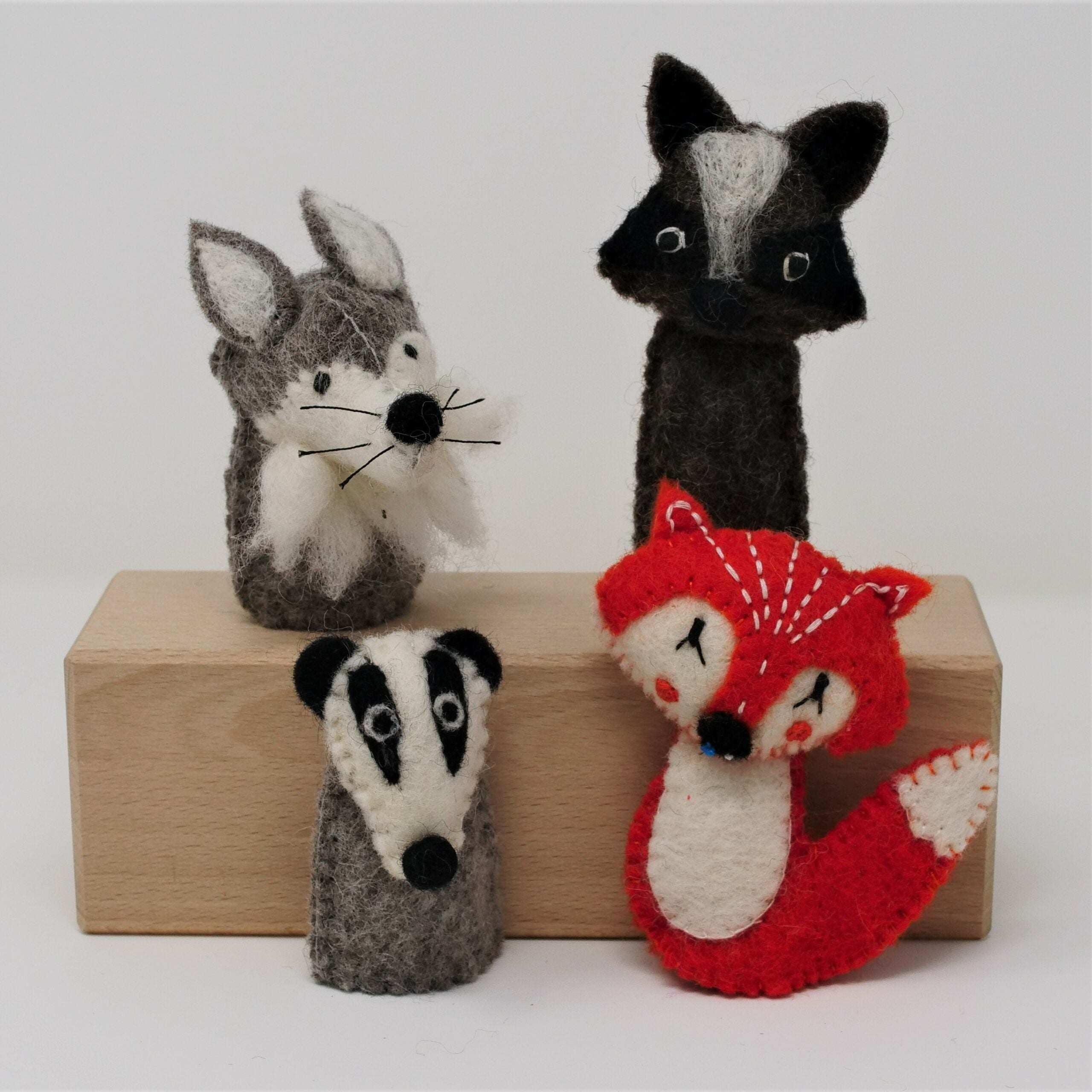 Colorful wool finger puppets in themed sets for imaginative play and storytelling