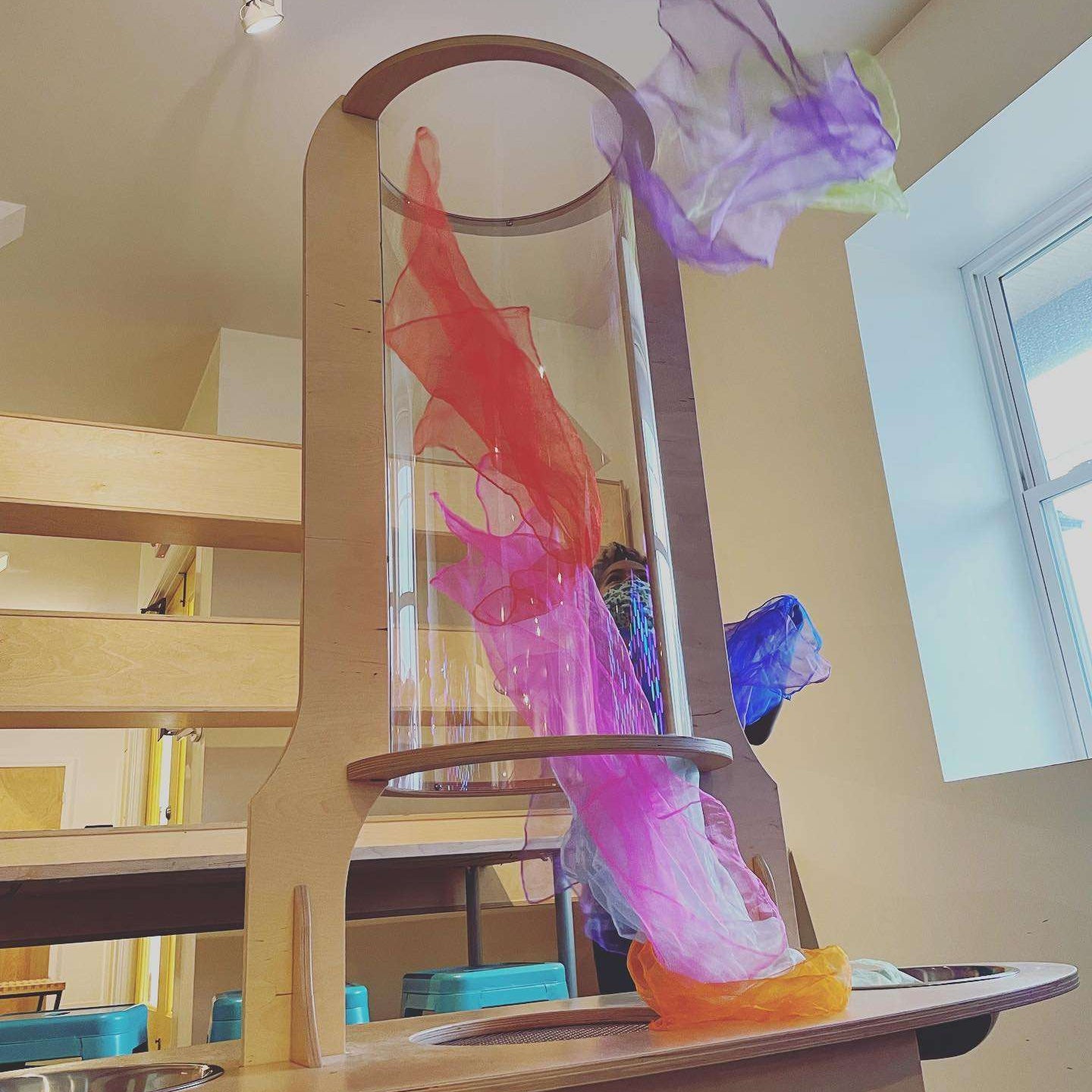 Baltic Birch wind tunnel with a clear cylinder and colorful floating scarves for STEM learning and air experiments.