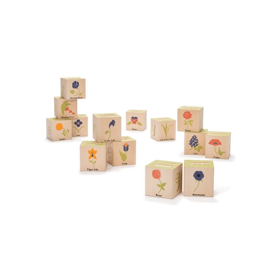 Uncle Goose wooden blocks featuring colorful Art Nouveau flower illustrations and debossed letters on a white background.