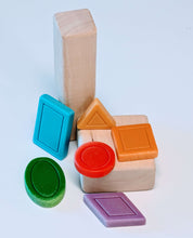 Set of colorful geometric patterning stones for math learning and sensory play