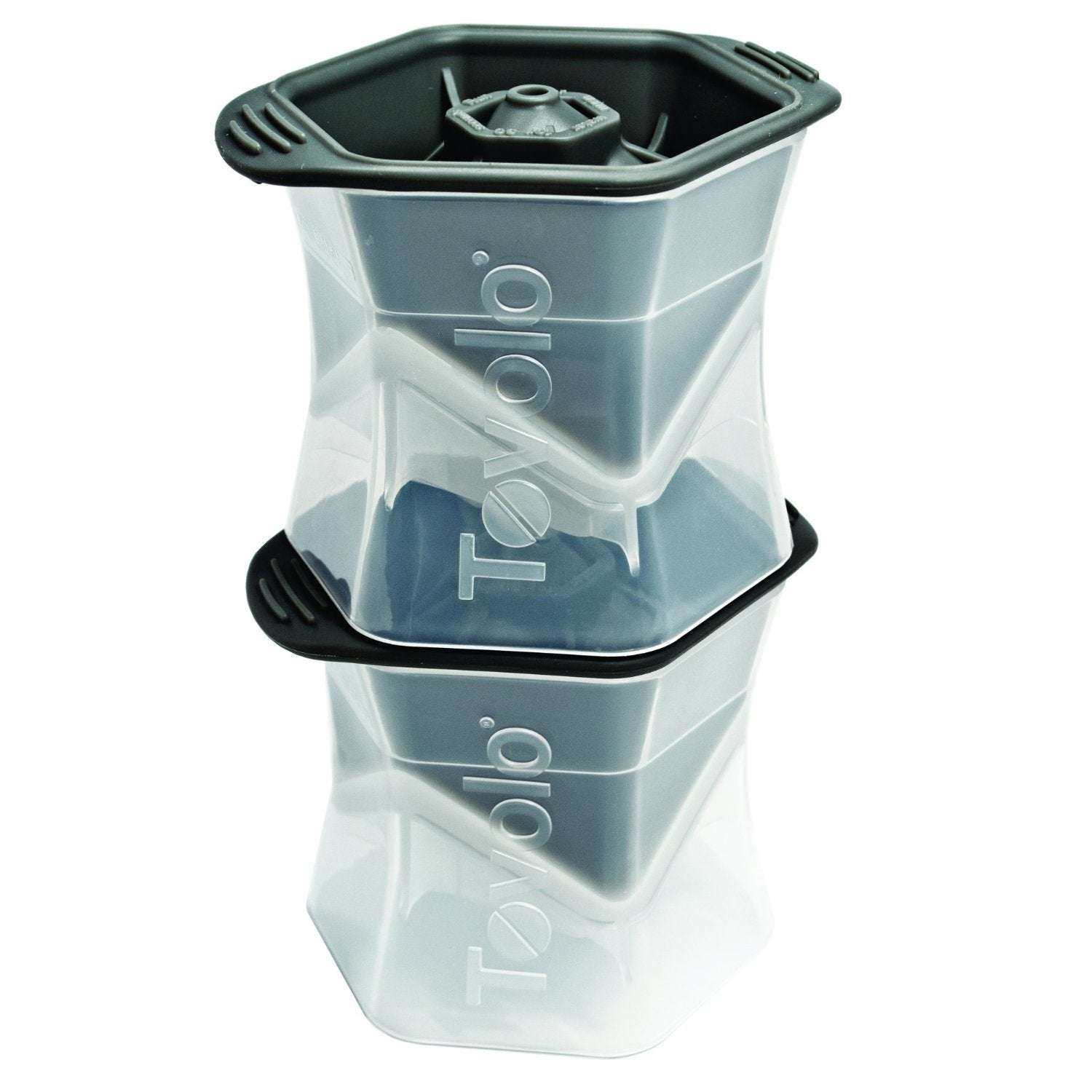Two Tovolo hexagonal ice molds stacked together, featuring clear plastic bodies and black silicone lids.