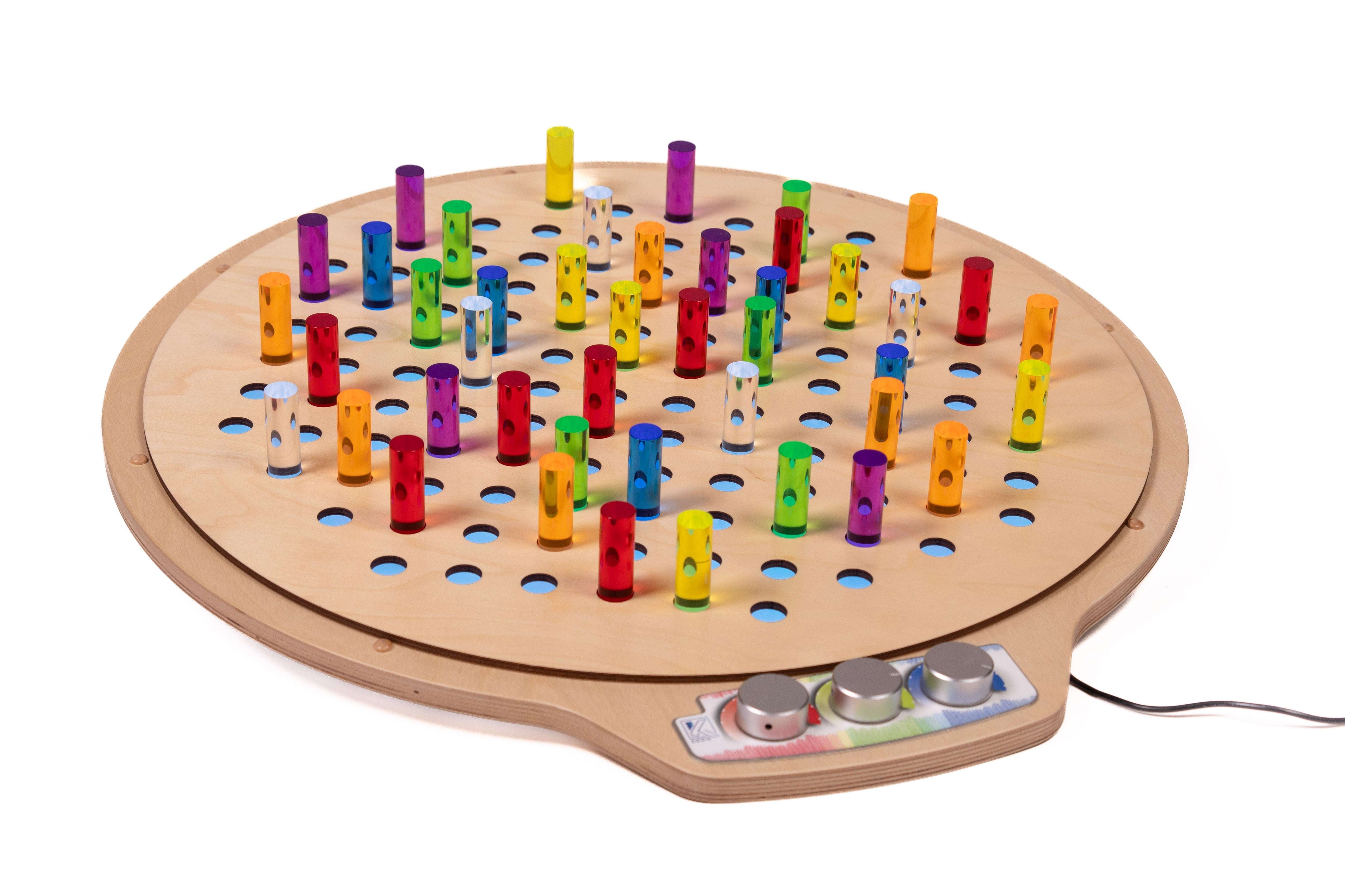 Circular birch wood pegboard with colorful translucent acrylic pegs and light control knobs on a white background.