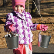Children using metal pails for outdoor learning and play activities