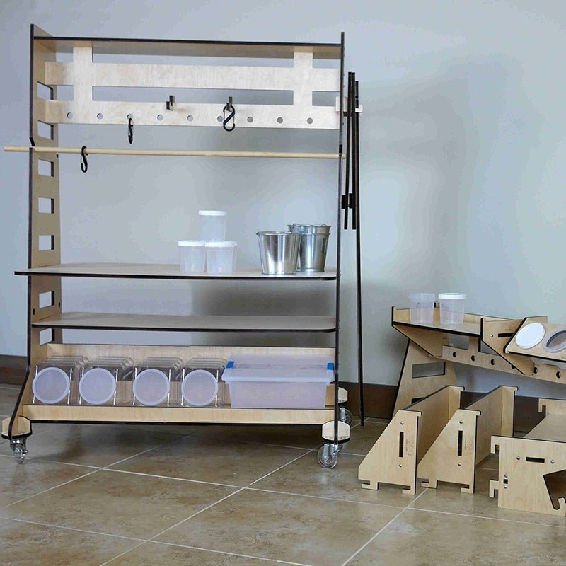 Mobile plywood maker station cart with locking casters, tool hooks, shelving, and clear storage bins for STEM classrooms.