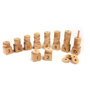 Natural beech wood number stacker with ten blocks featuring numerals, dice arrays, and dot patterns for early math learning.