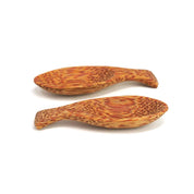 Two small, shallow spoons crafted from sustainable coconut shell with a textured, natural brown wood grain pattern.