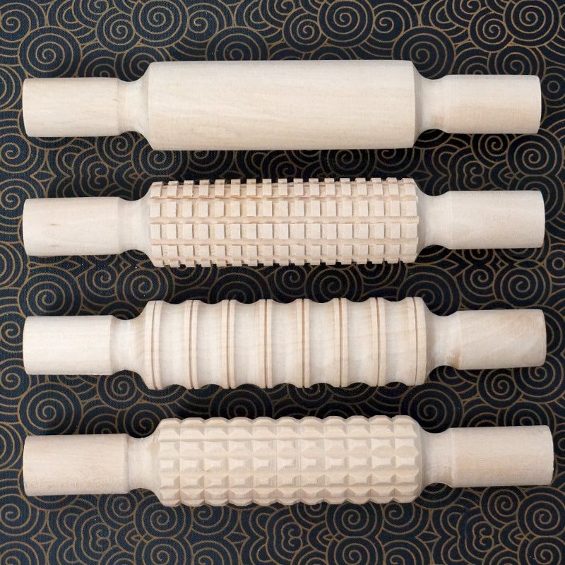 Wooden Patterned Rolling Pins on clay creating textured art designs