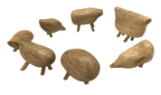 Handmade fair trade wooden animal figures with smooth, pebble-like bodies and small legs arranged in a circle.