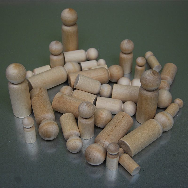 Collection of assorted natural wooden peg dolls in various sizes for open-ended play and creative building.