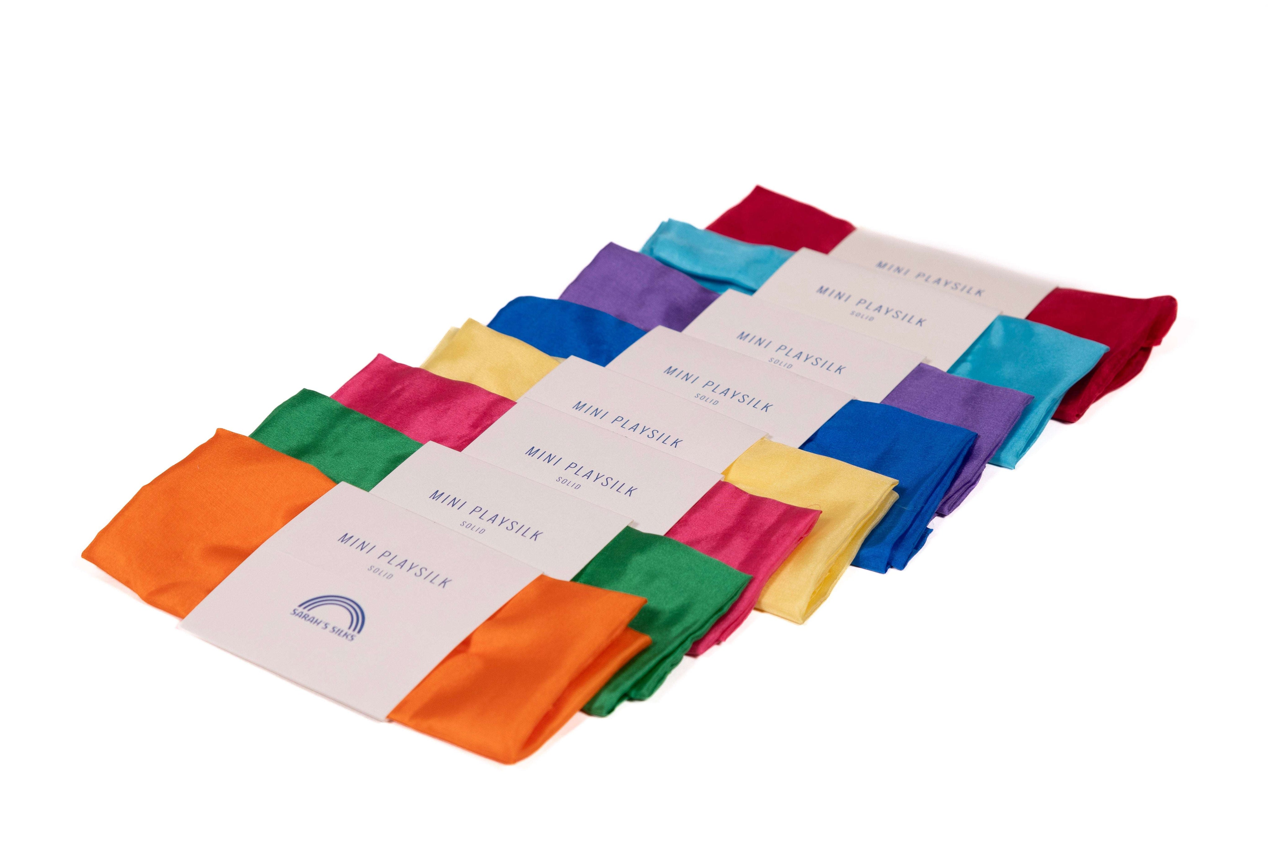 Colorful Mini Playsilks flowing in a wind tunnel, perfect for imaginative play and sensory experiences