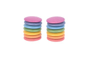 Two stacks of smooth, pastel-colored wooden discs for open-ended play.