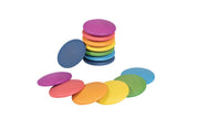 Stack of smooth, colorful wooden discs in rainbow shades arranged on a white background for open-ended play.