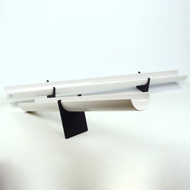 Two white plastic ramps supported by black fulcrum feet for STEM physics play.