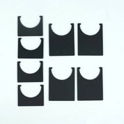 Set of black, flat-panel fulcrum feet with U-shaped cutouts for connecting ramps in a STEM obstacle course.
