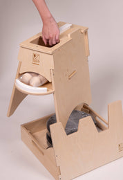 Wooden Rubber Ramp Tower with a ball storage balcony and a notched base for ramp elevation and compact storage.