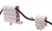 Children playing with a 25-foot flexible rubber ramp and stackable stands for STEM learning