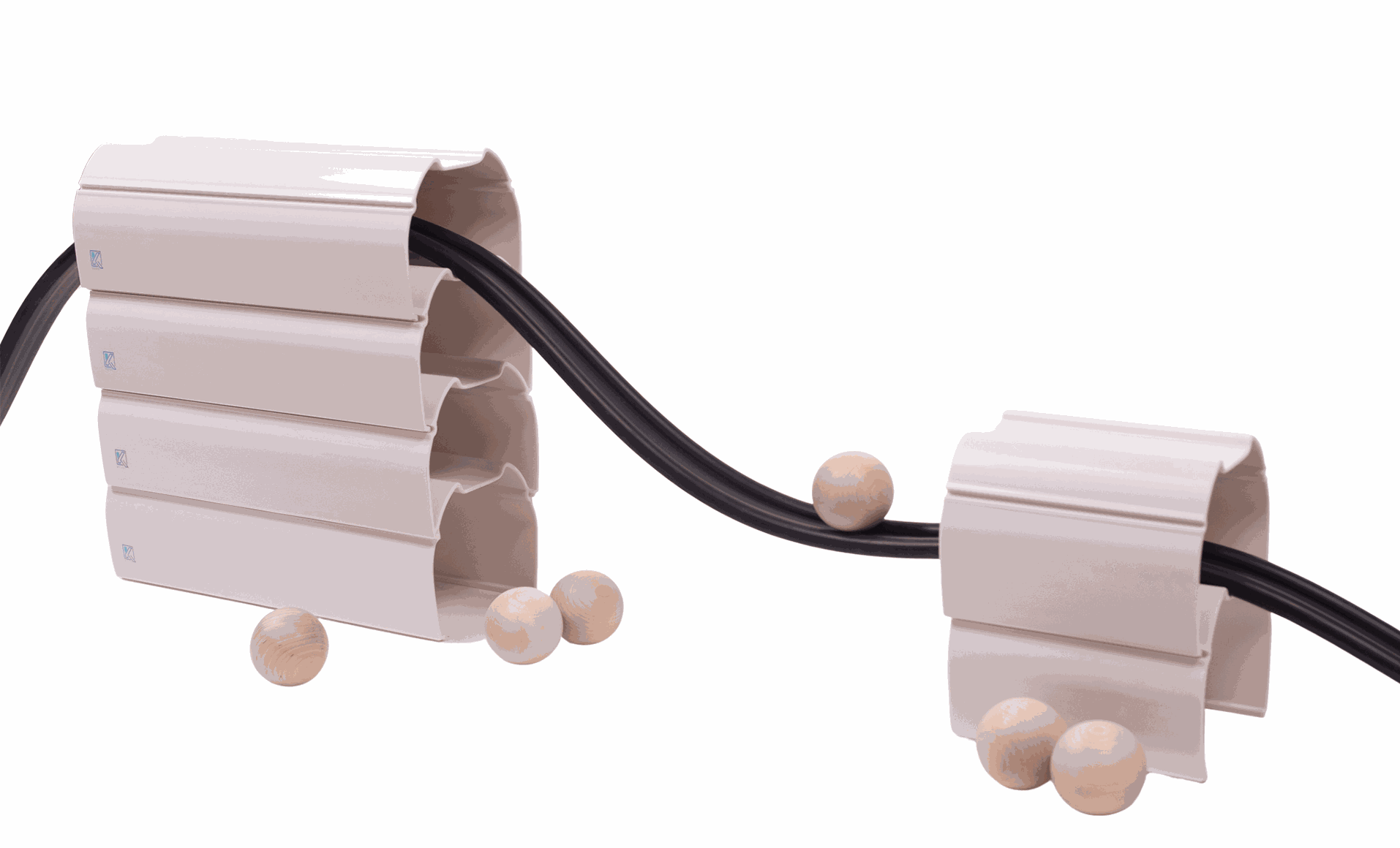 Children playing with a 25-foot flexible rubber ramp and stackable stands for STEM learning