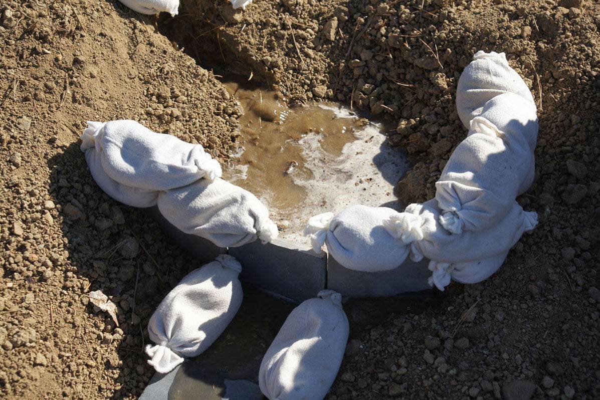 Children playing with flexible sandbags for creative building and spatial learning in a classroom setting