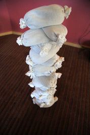 Children building creative structures with flexible sandbags in a classroom setting