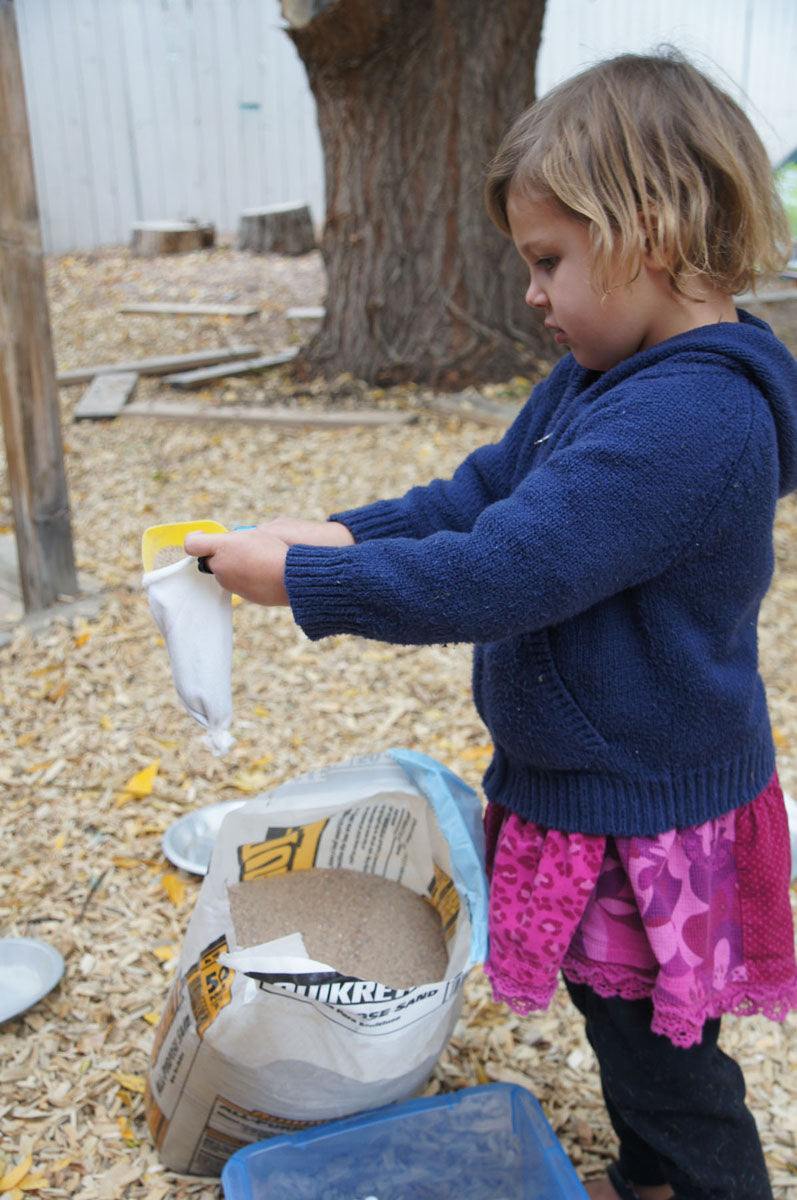 Children playing with flexible sandbags for creative building and spatial awareness development