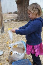 Children playing with flexible sandbags for creative building and spatial awareness development