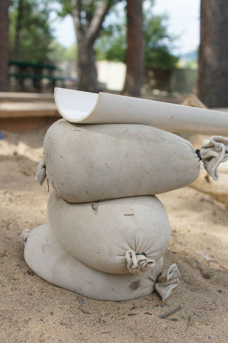 Children playing and building with flexible sandbags for creative construction and spatial awareness development