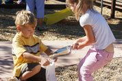 Children building with flexible sandbags for creative play and construction.