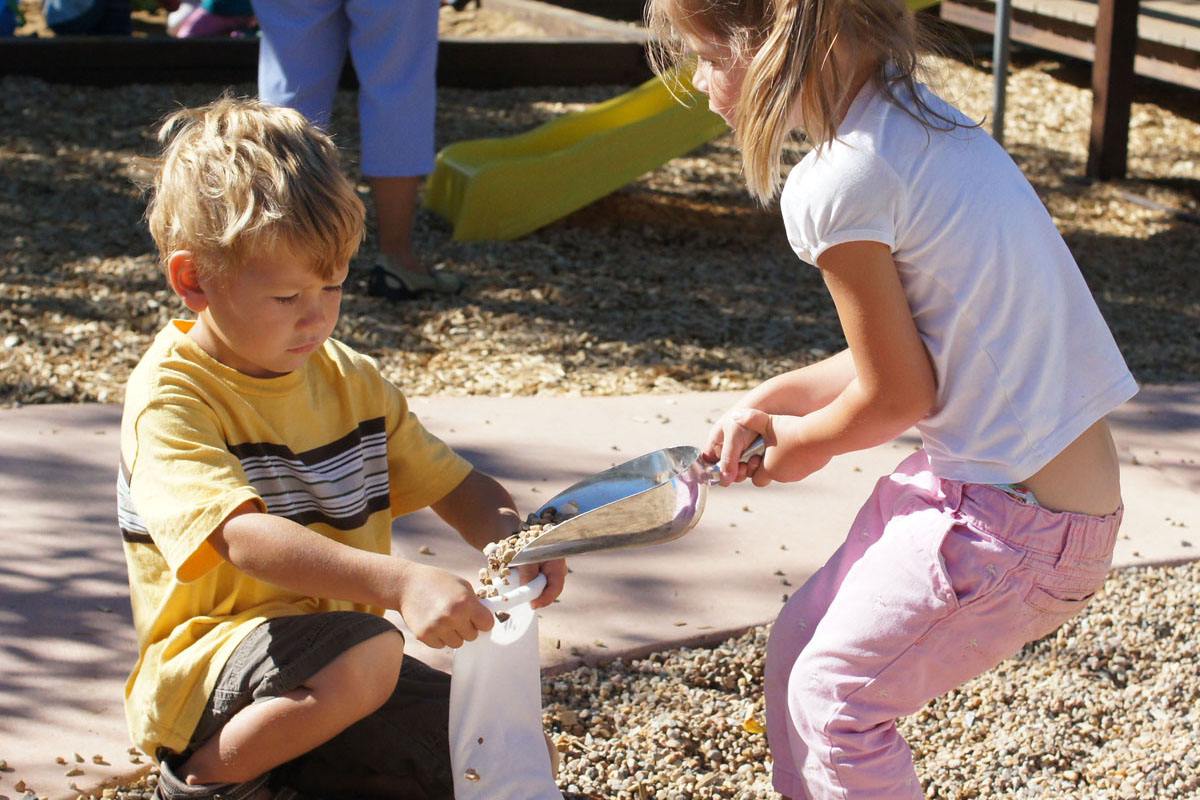 Children building with flexible sandbags for creative play and construction.