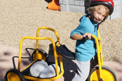 Children building creatively with flexible white sandbags in classroom play area