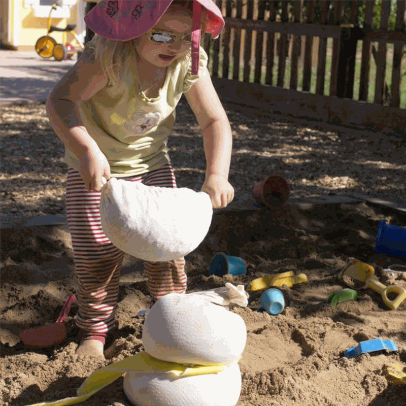 White sandbags for flexible children's construction and imaginative play in classroom and outdoor settings