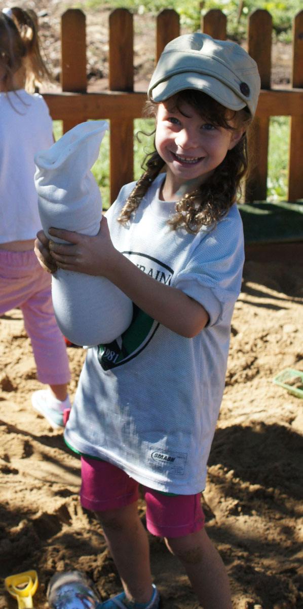Children playing and building creative structures with flexible sandbags in a classroom setting