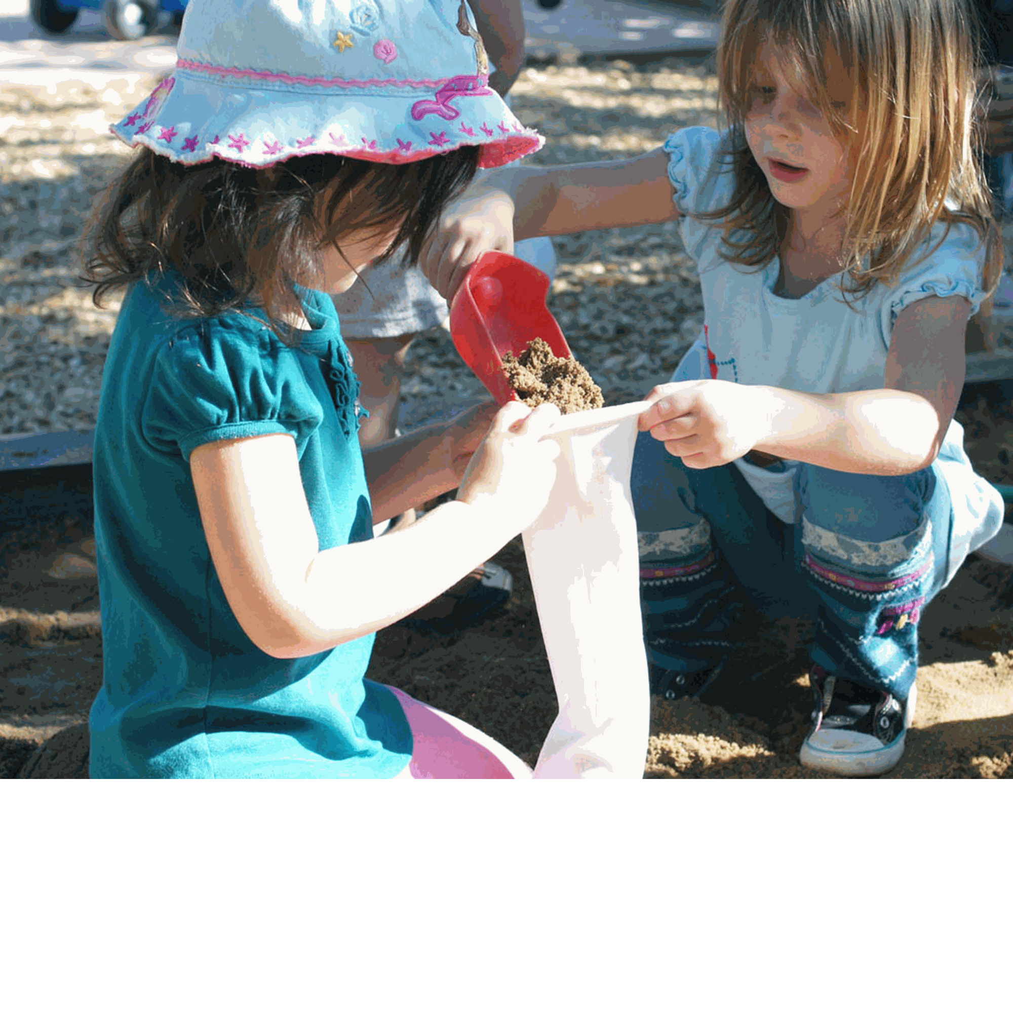Flexible white sandbags filled by children for imaginative play and construction learning